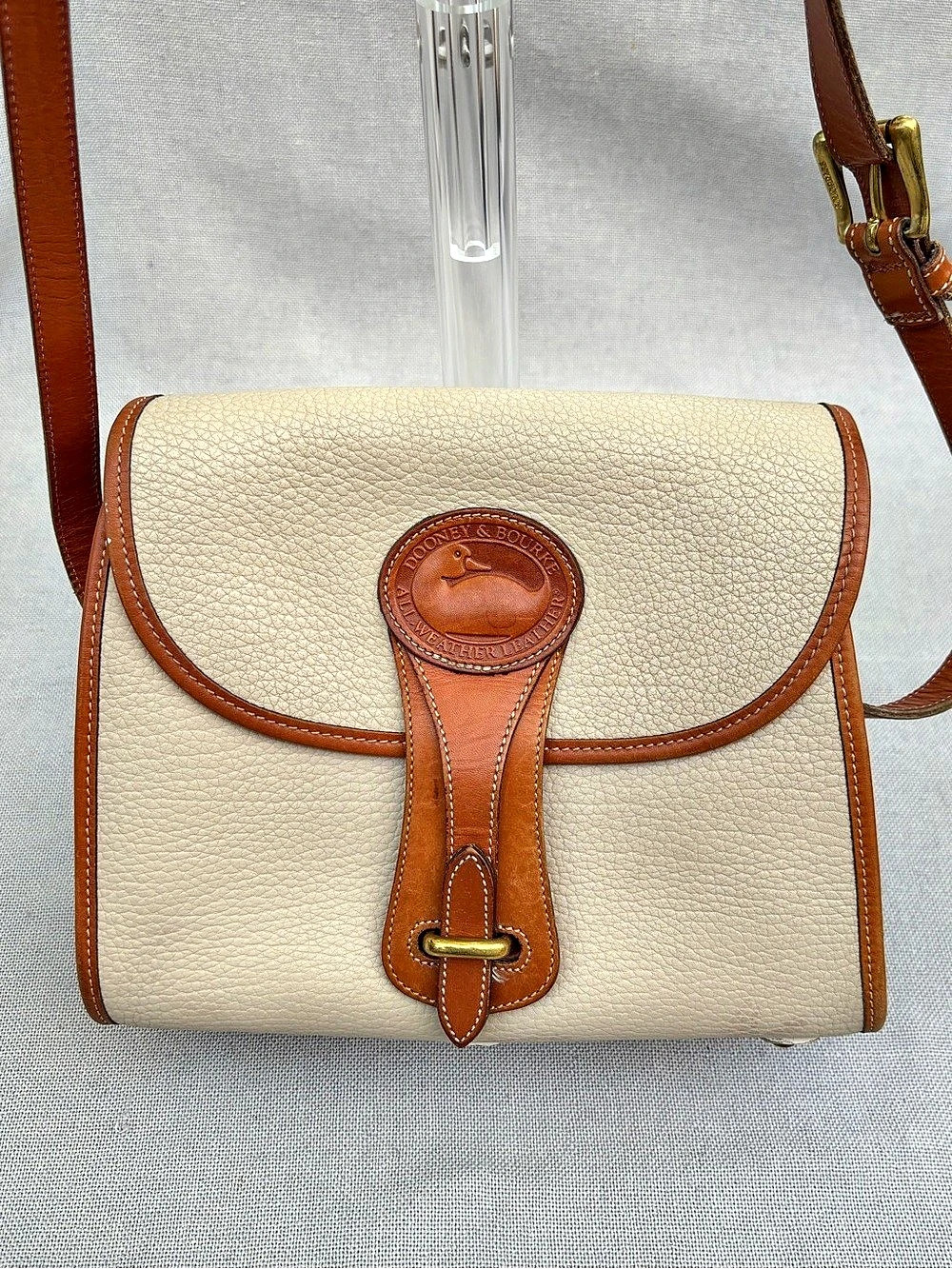 Dooney & Bourke All-Weather Leather crossbody bag Crossbody Bag in Cream & Brown